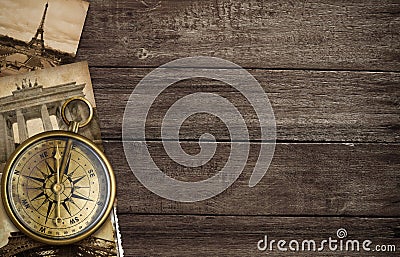 Brass antique compass with old postcards Stock Photo