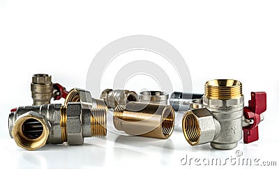 Brass ball valves and various brass and stainless steel sanitary fittings Stock Photo