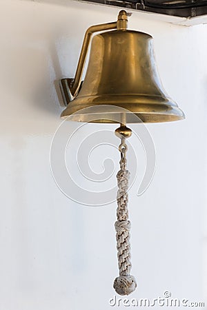 Old brass bell on a boat Stock Photo