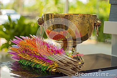 Brass bowl and bamboo wrapped in colored paper. Stock Photo