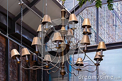 brass chandelier, Partial view of an elaborate brass chandelier, Vintage brass chandelier hanging on ceiling Stock Photo