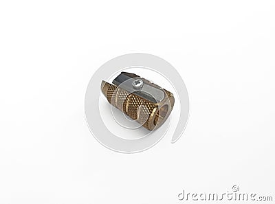 Brass pencil sharpener with a single hole isolated on white background. Close up. Pencil sharpener made of brass. Drawing, fine Stock Photo