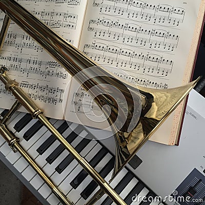 Brass Trombone and synthesizer keyboard and classical music Stock Photo