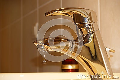 Brass water faucet Stock Photo