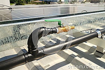 Brass Water Faucet with Thermal Welding Type HDPE Pipe on Roof for Solar Panel Cleaning Stock Photo