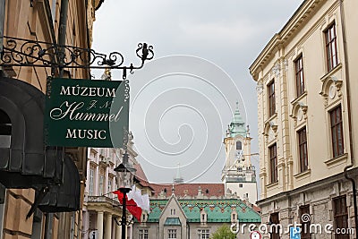 Bratislava, Slovakia - April, 2011: signboard of Museum Johana Nepomuka Hummela and Primate`s Square view from Klobucnicka. Editorial Stock Photo