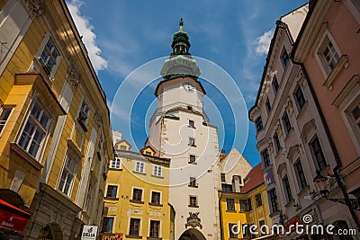 Bratislava, Slovakia: City street daily view of the historical buildings and the famous St. Michael`s Gate and Tower in the Editorial Stock Photo