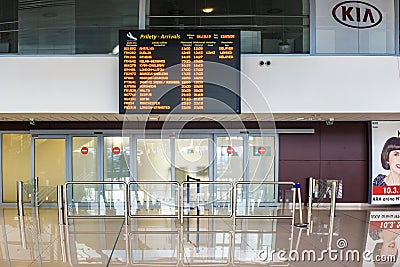 BRATISLAVA, SLOVAKIA â€“ OCTOBER 6 2019: Arrivals board above closed doors of baggage claims room in Arrivals hall of Bratislava Editorial Stock Photo