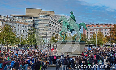 Collection of demonstrators under the equestrian statue of the duke on the castle square Editorial Stock Photo