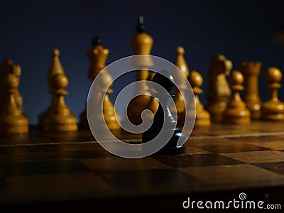 Brave ambitious businessman and challenge. Black wooden pawn and chess Stock Photo