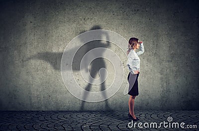 Brave business woman posing as super hero Stock Photo