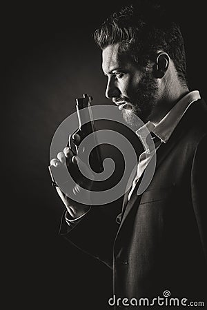 Brave man with handgun Stock Photo