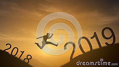 Brave man successful concept,silhouette man jumping over the sun between gap of the mountain from 2018 to 2019 new year , it feel Stock Photo