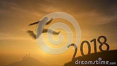 2018 brave man successful concept,silhouette man jumping over th Stock Photo