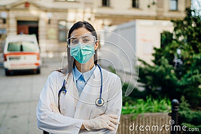 Brave optimistic paramedic in the front lines,working in a isolation hospital facility with infected patients.Covid-19 emergency Stock Photo