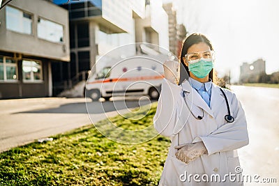 Brave optimistic paramedic in the front lines,working in a isolation hospital facility with infected patients.Covid-19 emergency Stock Photo