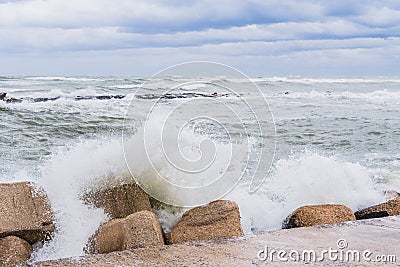 Brave waves of the Adriatic sea beating against the breakwater of the seafront in Bari, Italy Stock Photo