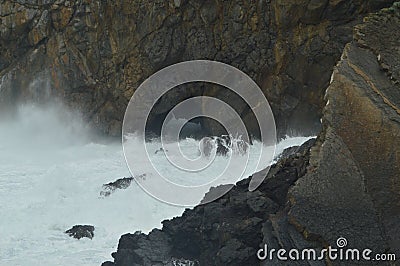 Brave Waves Breaking Against The Rocks Where The Hermitage Of San Juan De Gaztelugatxe Is Located Here Game Of Thrones Filmed. Arc Stock Photo