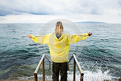 Brave woman greeting stormy Stock Photo