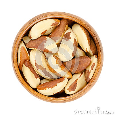 Brazil nuts, dried seeds of Bertholletia excelsa in wooden bowl Stock Photo