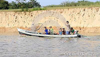 Brazil, Obidos: Amazon River - Brazilian Family in Boat with GPS Dish Editorial Stock Photo