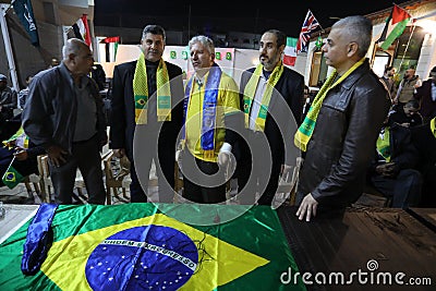 The Brazilian ambassador to Palestine, Francisco Mauro Uland Brasil, watches the Brazil national team match against Switzerland Editorial Stock Photo