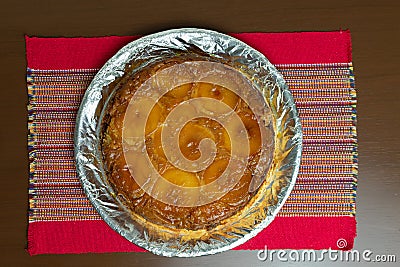 Brazilian apple pie, sweet very famous in Brazil on the wood table kitchen. Top View Stock Photo