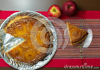 Brazilian apple pie, sweet very famous in Brazil on the wood table kitchen. Top View Stock Photo