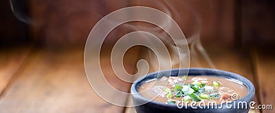 Brazilian bean broth, in a clay bowl with heat smoke, hot brazilian food Stock Photo