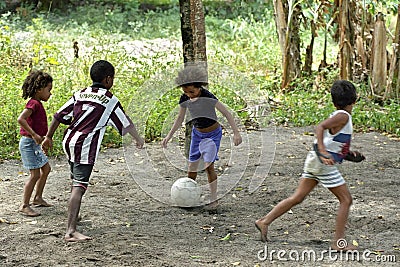 Brazilian boys and girls playing football in tropical heat Editorial Stock Photo