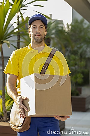 Brazilian mailman delivering a package Stock Photo