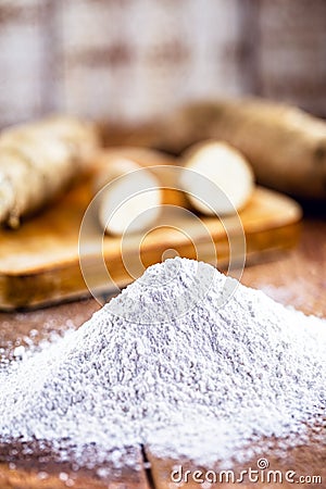 Brazilian manioc flour, called polvilho, manioc starch, carimÃ£ or gum, is the manioc starch. Rustic kitchen background with Stock Photo