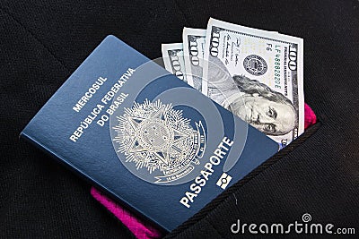 Brazilian passport and dollars Stock Photo