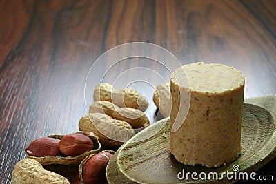Brazilian peanut candy called PaÃ§oca on the wooden spoon. June party food. Stock Photo