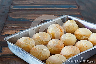 Brazilian snack cheese bread (pao de queijo) on oven-tray Stock Photo