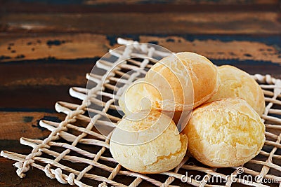 Brazilian snack cheese bread (pao de queijo) on wooden table Stock Photo