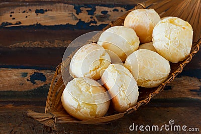 Brazilian snack pao de queijo (cheese bread) in wicker basket Stock Photo