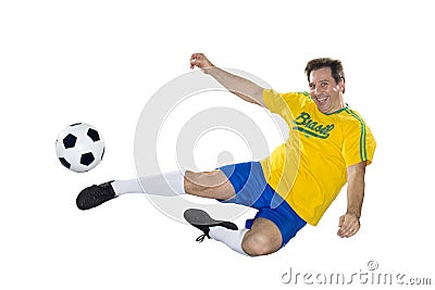 Brazilian Soccer player, jumping, yellow and blue. Stock Photo