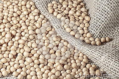 Brazilian soybean seeds on jute background Stock Photo