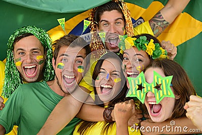 Brazilian sport soccer fans celebrating victory together. Stock Photo