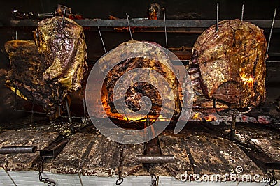 Brazilian style beef ribs Barbecue grill on skewers at a churrascaria steakhouse Stock Photo