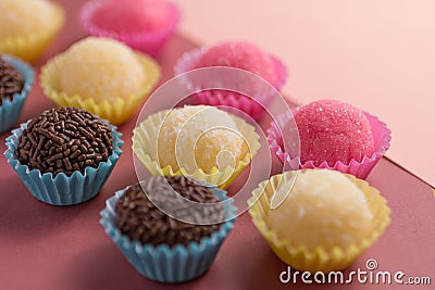 Brigadeiro, Beijinho and Bicho de Pe: sweets from Brazil. Child Stock Photo