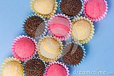 Brigadeiro, Beijinho and Bicho de Pe: sweets from Brazil. Child b Stock Photo