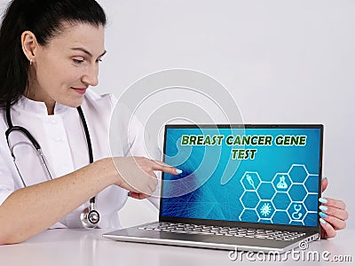 BRCA BREAST CANCER GENE TEST text in search bar. physician looking for something at laptop Stock Photo