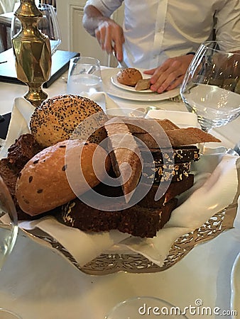 Bread basket on dinner table. Stock Photo