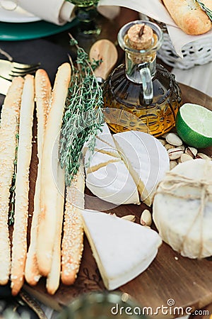 bread, cheese and olive oil on italian picnic Stock Photo