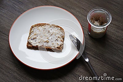 Bread and dripping or crackling fat or lard with greaves called Schmalzbrot in Germany Stock Photo