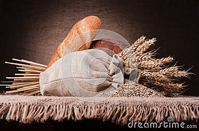 Bread, flour sack and ears bunch still life Stock Photo