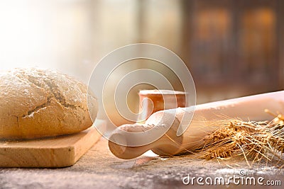 Bread loaf homemade with kneader on black table front Stock Photo