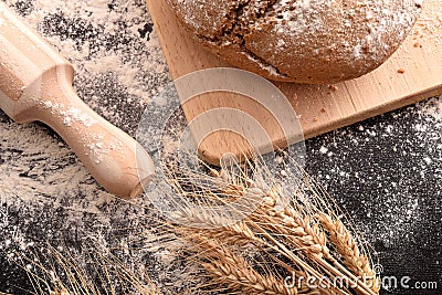 Bread loaf homemade with kneader on black table top Stock Photo